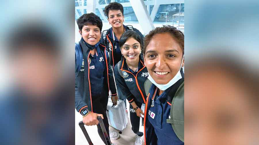 Harmanpreet Kaur (right) with teammates before leaving for Colombo on Saturday. 