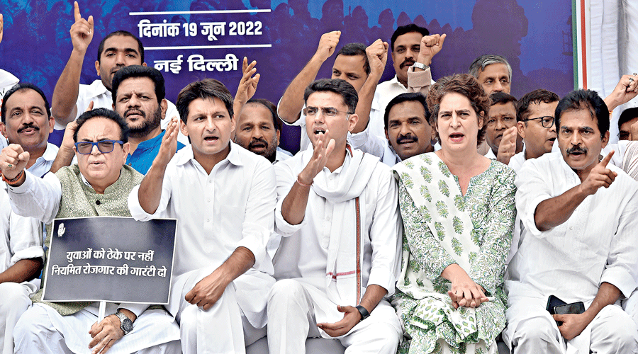 Congress leaders Priyanka Gandhi Vadra, KC Venugopal, Sachin Pilot and Deepender Singh Hooda shout slogans during the Congress’s ‘Satyagraha’ against the Agnipath scheme at Jantar Mantar in New Delhi on Sunday. 