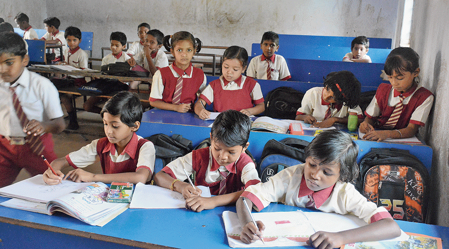 Students back to schools in Kolkata after long summer break