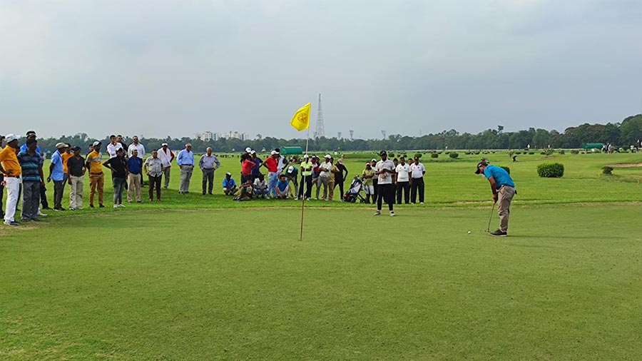 Rafick on his way to stroking the winning putt