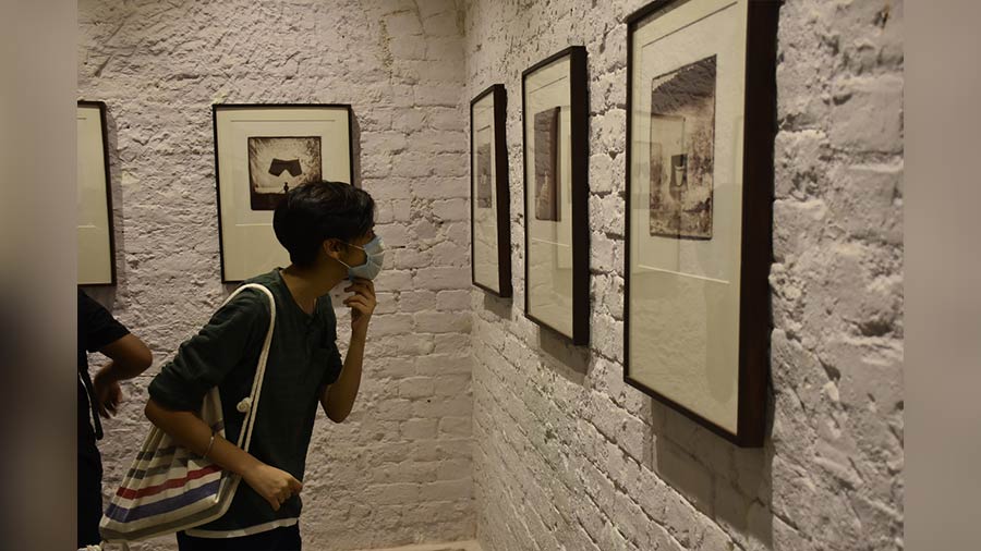 A visitor looks at the art works 