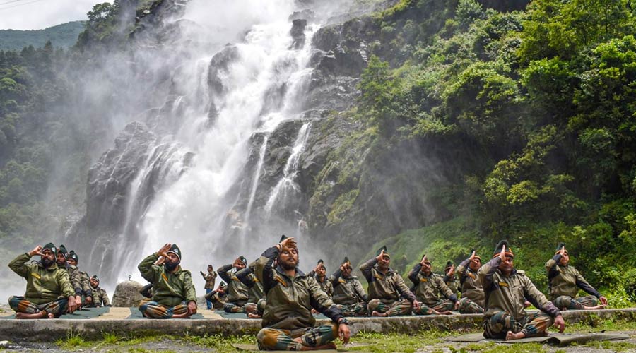 Army personnel take part in a yoga event conducted above a height of 12000 ft in a remote area of Arunachal Pradesh