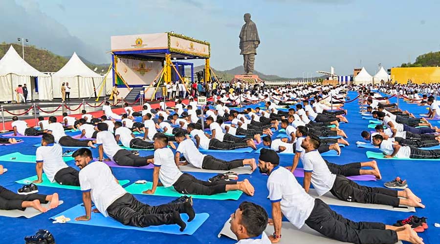 BSF personnel perform yoga at a mass yoga session to celebrate International Day of Yoga, in Kevadiya, Gujarat