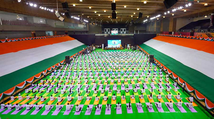 A mass yoga session at the Thyagaraj Stadium to celebrate the International Day of Yoga, in New Delhi