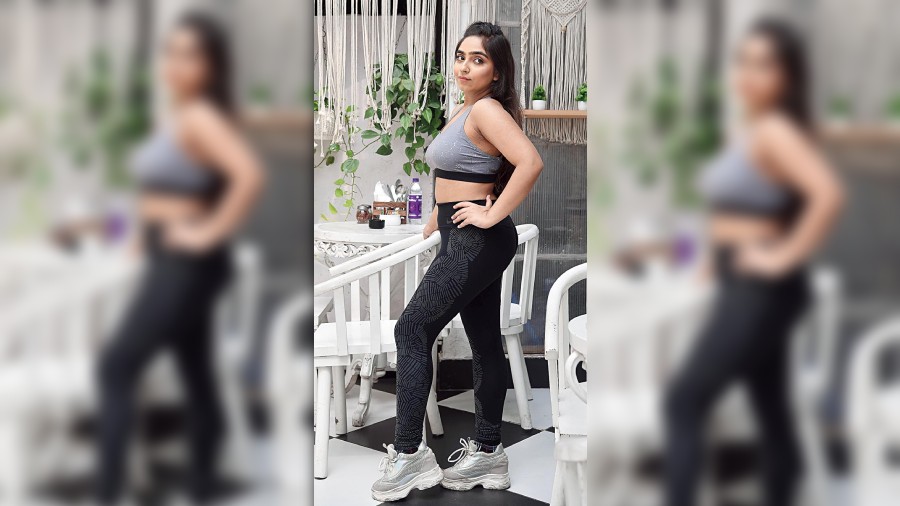 Comfy gym look: A coordinated black and grey activewear from Adidas and Nike, paired with trending chunky sneakers. “I went for coord sets for this look as right now coord sets are in. Though people are opting for colourful activewear, I chose the classy black as it will never go out of trend,” explained Manya.