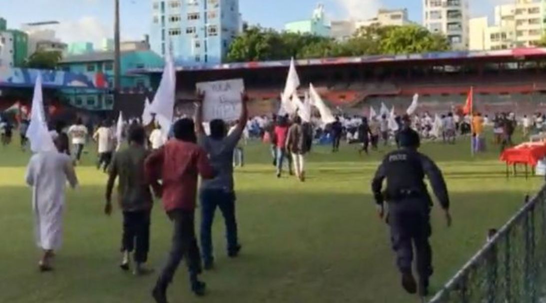 Protesters disrupt the event celebrating International Day of Yoga at a stadium in Male, Maldives, on Tuesday.