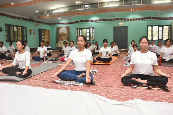 Banaras Hindu University (BHU) vice-chancellor Sudhir K Jain led students, faculty members and staff at a yoga session held at Malaviya Bhavan. 