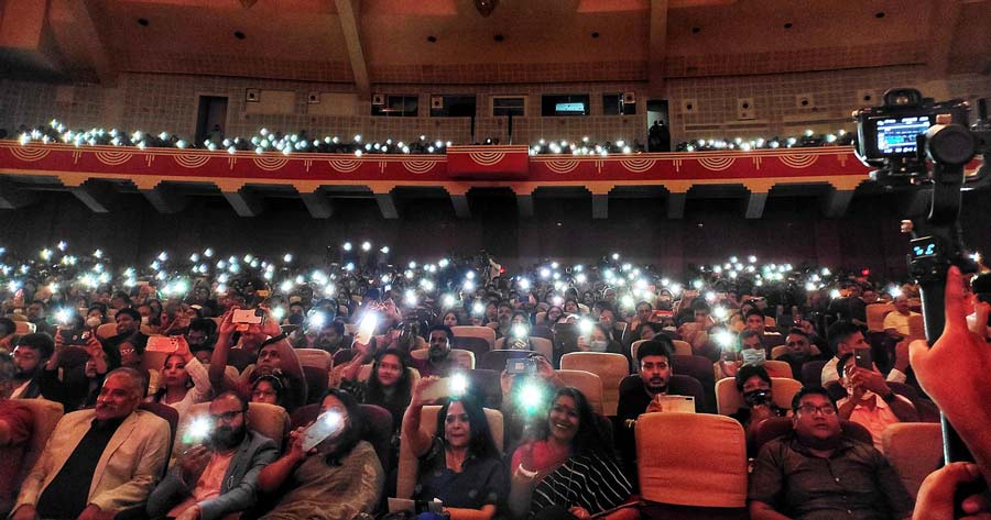 Science City Auditorium became an antidote to the cloudy sky outside, as two thousand people illuminated the stage with their flashes to remember the nightingale of India