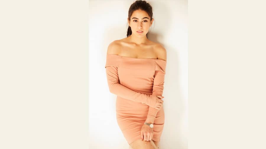 A nude off-shoulder dress is chic fashion done right. 