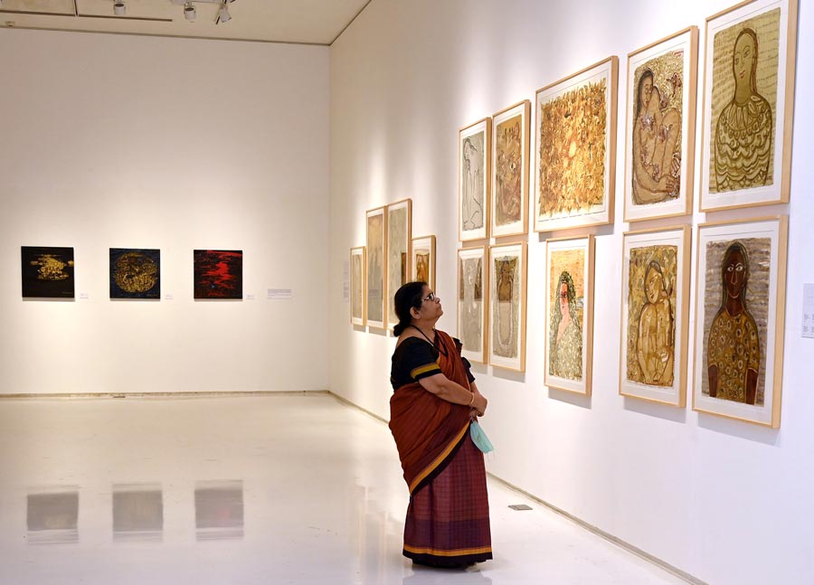 A visitor looks on at some of Arunima Chowdhury's representations of feminism through art. 
