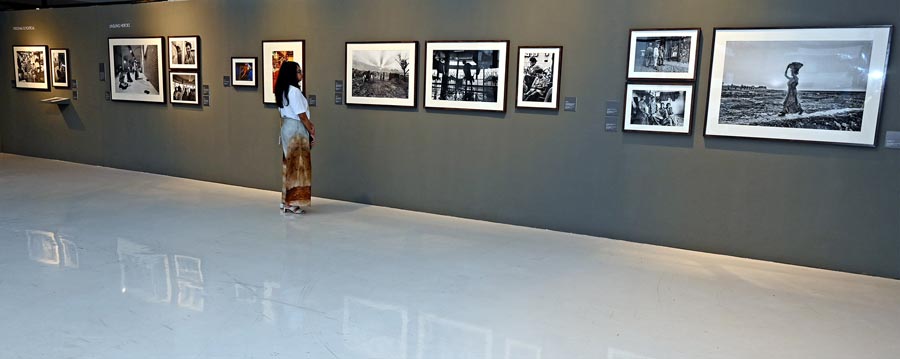 A visitor looks at the photographs featured in the unsung heroes section.