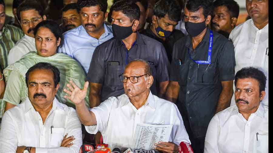 Nationalist Congress Party chief Sharad Pawar (M) addresses media after a party meeting, at Yashwantrao Chavan Centre in Mumbai on Thursday