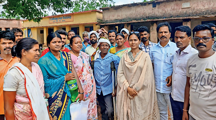 Congress candidate Shlipi Neha Tirkey (centre) at a polling  booth in the Bero block of Mandar constituency on Thursday.