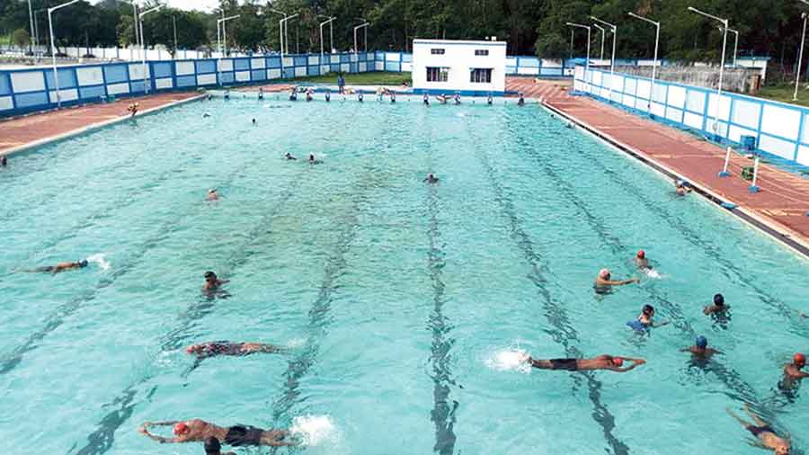 Swimmers take a dip at the pool opposite Mayukh Bhavan 