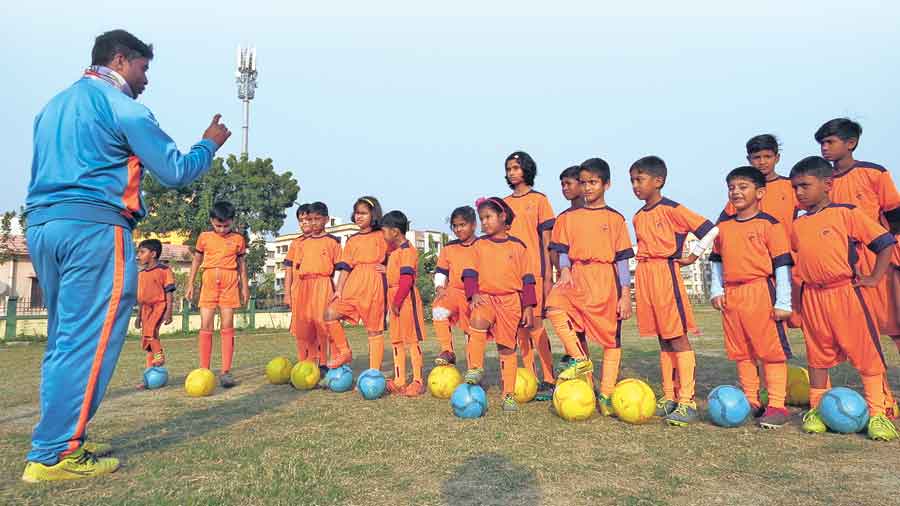 A file picture of children enrolled at the New Town CE Block football coaching camp. The block association has stopped both its football and cricket coaching camps after the NKDA notice was put up at the park. 