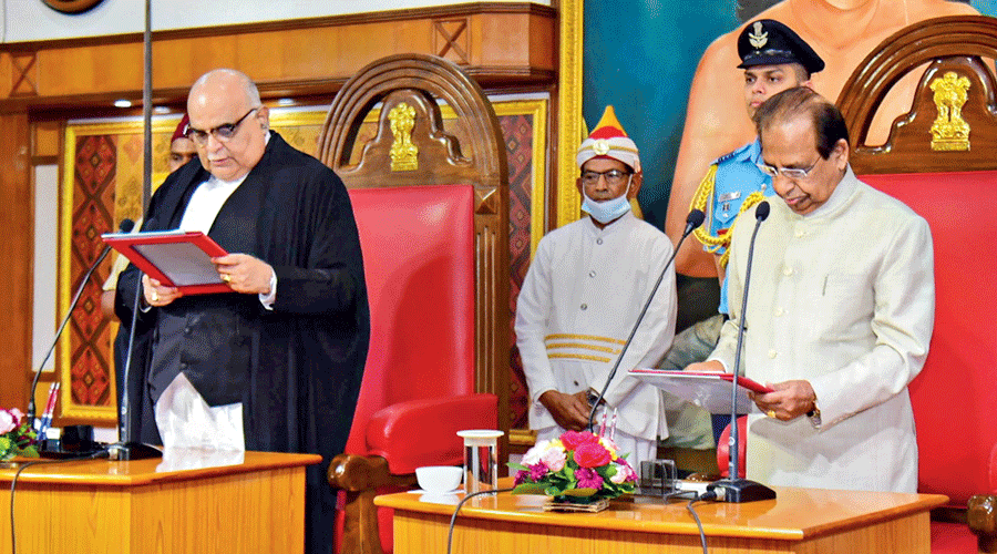 Assam governor Jagdish Mukhi administers the oath of office to Gauhati High Court  Chief Justice RM Chhaya (left) at the Raj Bhavan in Guwahati on Thursday.