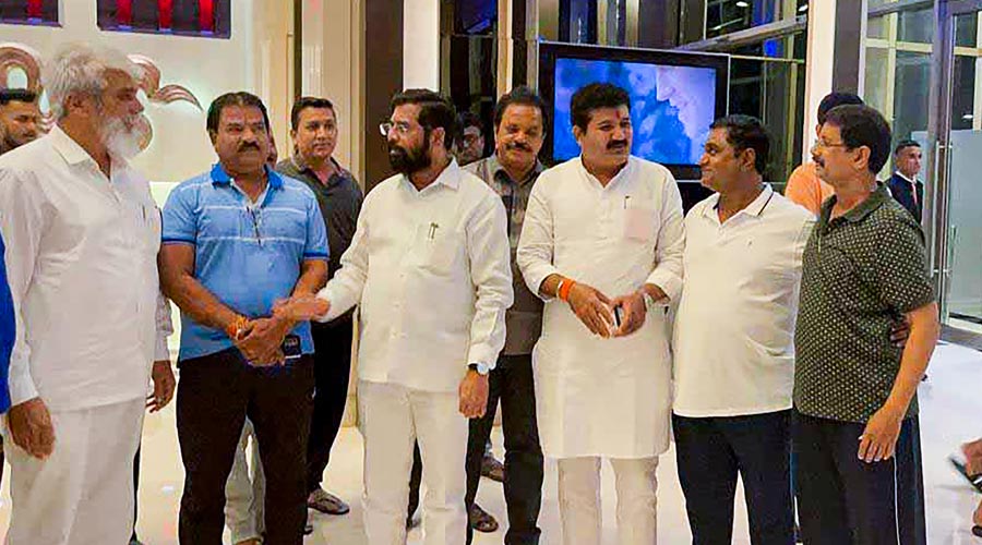 Rebel Shiv Sena MLA Eknath Shinde with Minister of Agriculture of Maharashtra Dadaji Dagadu Bhuse and other rebel MLAs at a hotel in Guwahati.