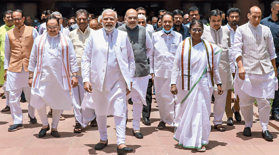 Droupadi Murmu with Prime Minister Narendra Modi and others on her way to filing nominations