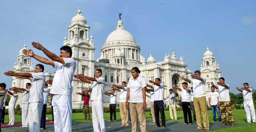 Central Industrial Security Force personnel at Victoria Memorial Hall during a yoga session to mark International Yoga Day on Tuesday, June 21. 