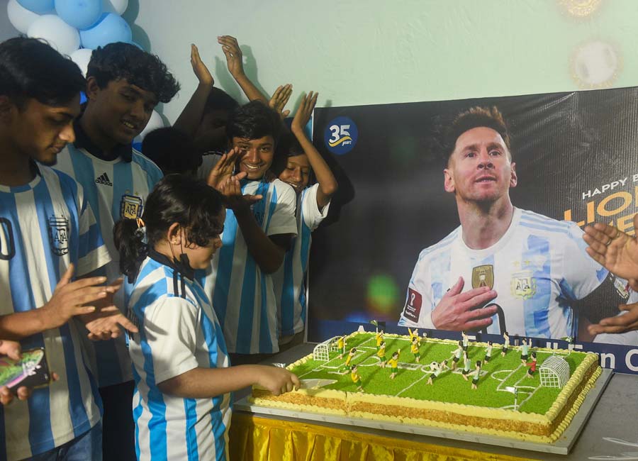 Messi fans cut a football ground-shaped cake to celebrate the footballer’s 35th birthday on June 24. The Argentine footballer turned 35 this year.