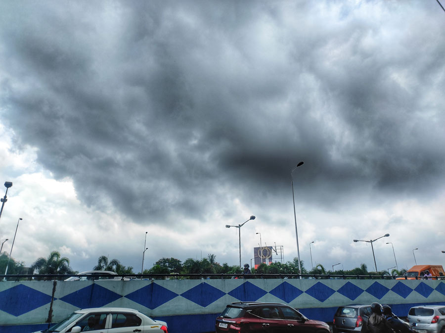 Monsoon clouds gather over a city flyover on Saturday, June 25.