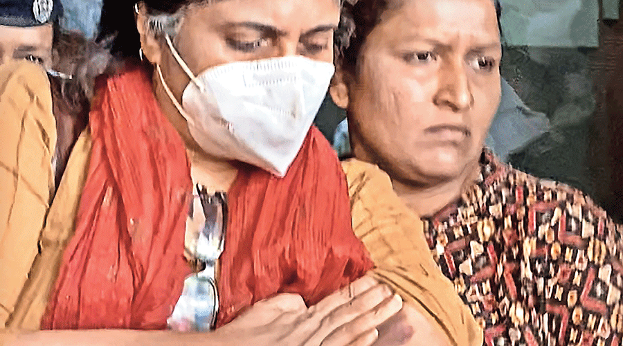 Teesta Setalvad comes out of a hospital following a medical examination in Ahmedabad on Sunday. Setalvad’s complaint to Mumbai police on Saturday had alleged that Gujarat police barged into her premises and that there was a big bruise on her left hand.