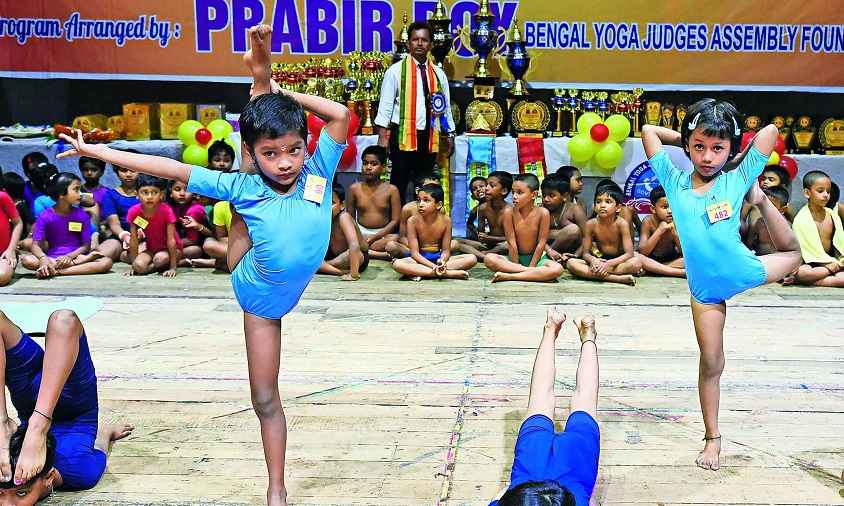 Kids take part in the 3rd All Bengal Yoga Talent Championship at Sarat Sadan in Howrah on Sunday.