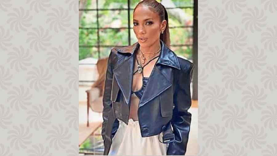 Jennifer Lopez posted her cropped leather jacket and skirt look in the classic black-and-white on Instagram to crowdsource some fashion advice and both looks received approval from her fans. Our vote goes to the one with the jacket in this spiffy and classy party look.