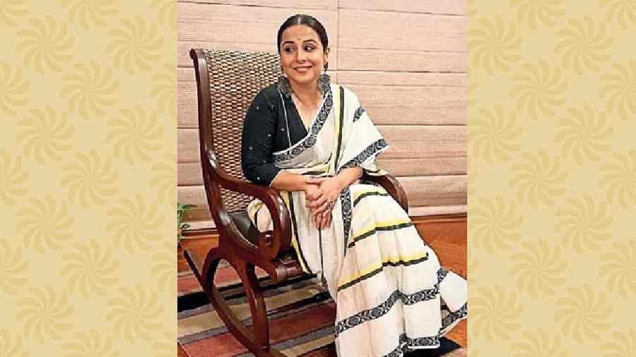 Vidya Balan paired her red and white polka dot sari with an interesting  sleeveless striped blouse