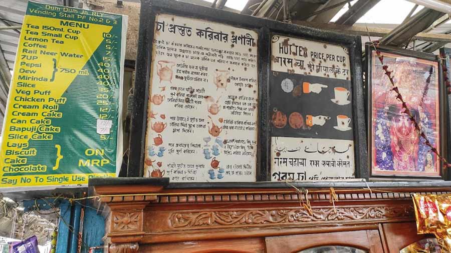 Tin boards highlighting the benefits of tea and the process of making a cup of tea at a pre-Independence-era tea stall at Dum Dum station