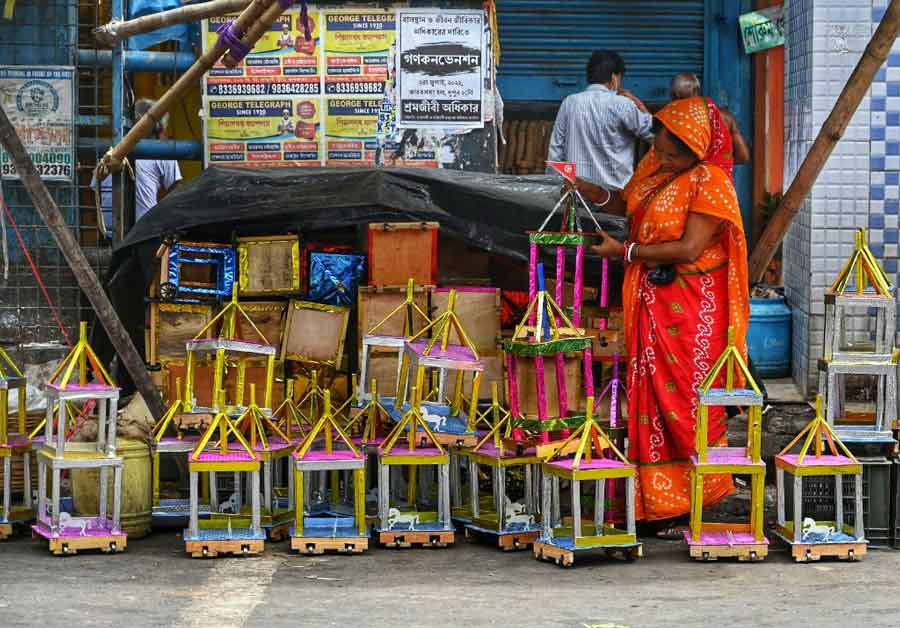 A woman sets up a roadside chariot stall on Tuesday. ‘Rath Yatra’ is on July 1 this year.