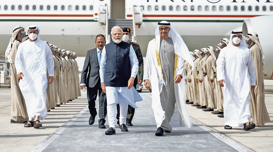 President of the United Arab Emirates Sheikh Mohamed bin Zayed Al Nahyan receives Prime Minister Narendra Modi at the presidential airport in Abu Dhabi on Tuesday.