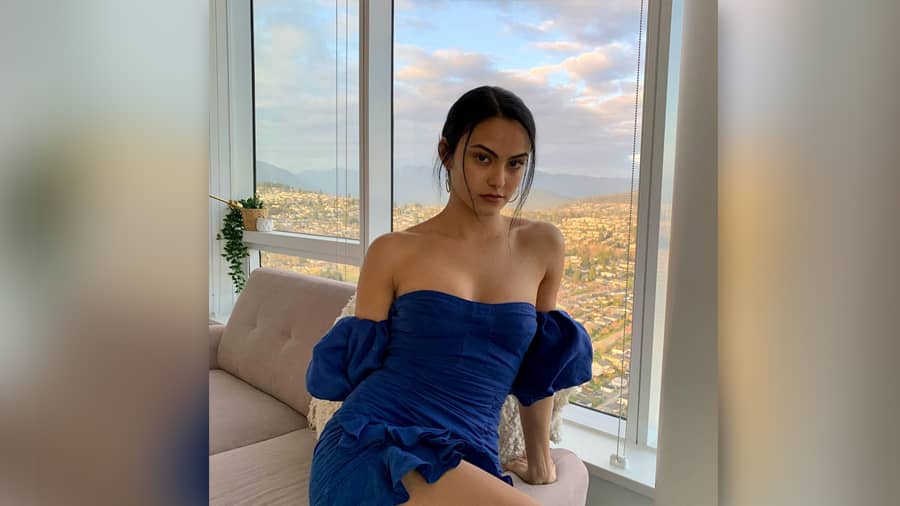 Veronica Lodge of ‘Riverdale’ is a fashion icon both on and off-screen.  Check out the actress in a navy blue off-shoulder, puff sleeve Isabel Marant number. The simple hoop earrings complete the look.