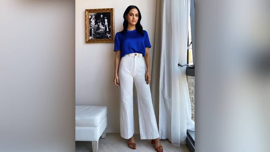 Did you know the actor-singer born to Brazilian parents made her acting debut with an IKEA commercial? We love how Camila paints a pretty picture in a blue top and white bell bottoms here — a perfect lookbook for summer outdoor plans.
