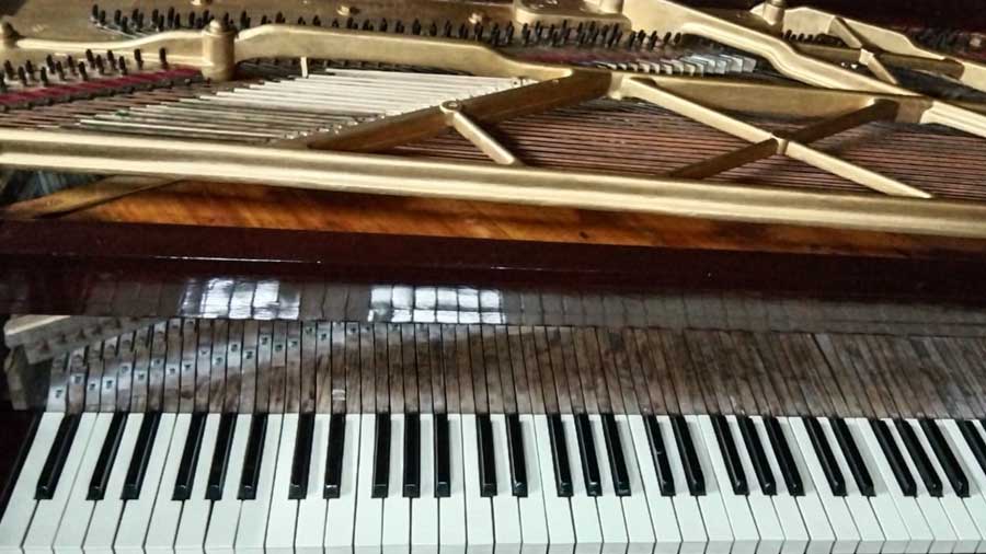 The restored, mahogany bark, square German piano that Rabindranath Tagore played during his time in Shillong  