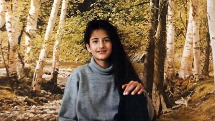 Marvel at young Katrina Kaif posing in front of a forest wallpaper.