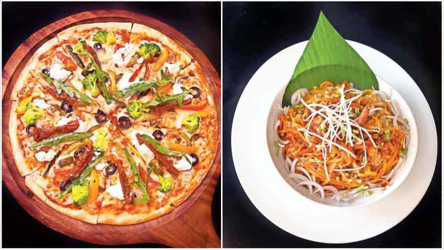 (L-R) Giardinera is a vegetarian pizza loaded with jalapenos, olives, dried tomatoes, chargrilled veggies, feta and mozzarella cheese; Noodles lovers, dig into Signature Hokkien Noodle that has flat noodles tossed in a super spicy chef’s secret sauce.