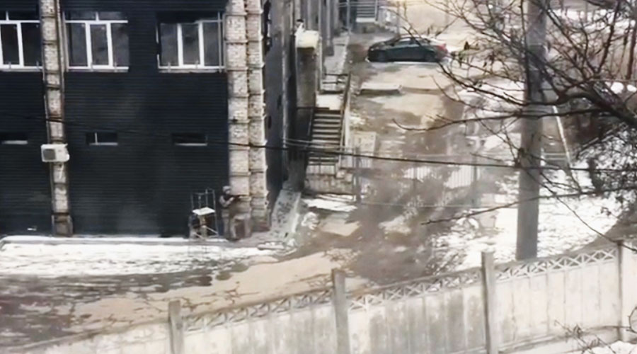A still from the video shot by Sarbori Biswas from the window of her flat in Kharkiv on Monday morning shows a soldier stealthily approaching the edge of a building wall and then taking aim. Another trooper takes position and crouches under a structure behind him. 