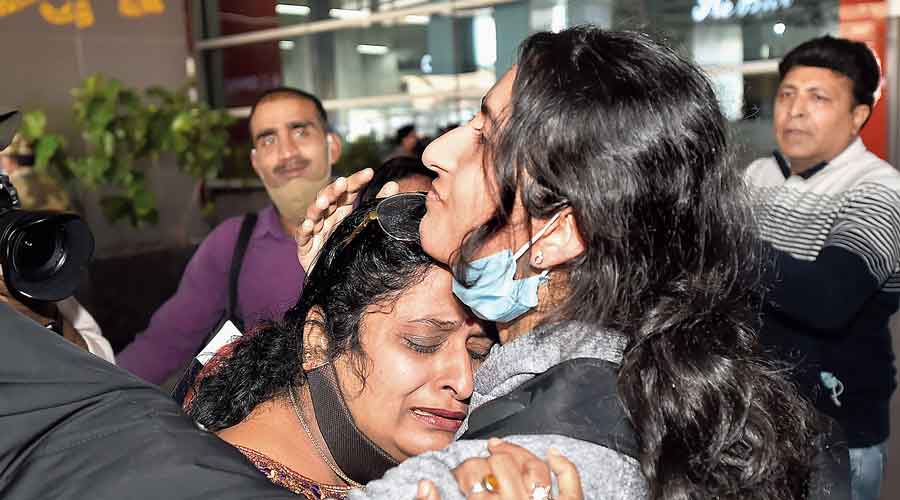 An Indian student evacuated from Ukraine being greeted by her family member at the  IGI Airport in New Delhi on Wednesday. 