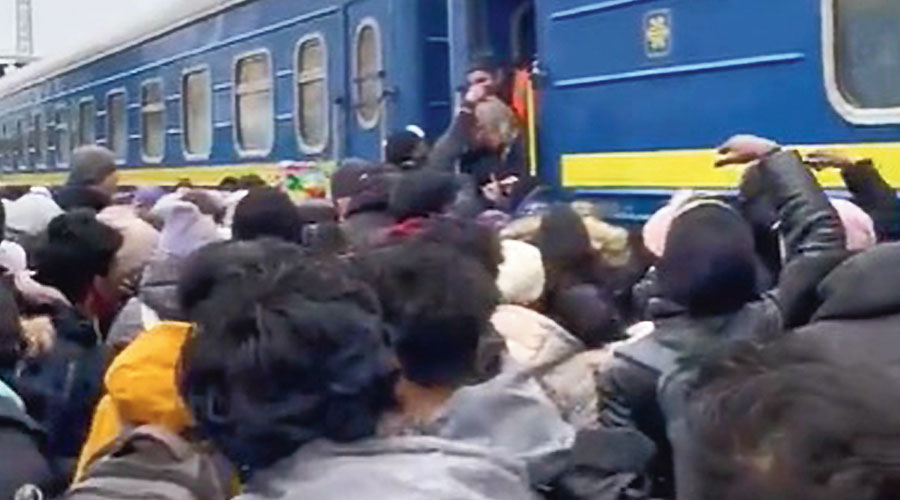 Many try to get into a train out of Kharkiv on Wednesday. Several Indian students who tried to board the train failed