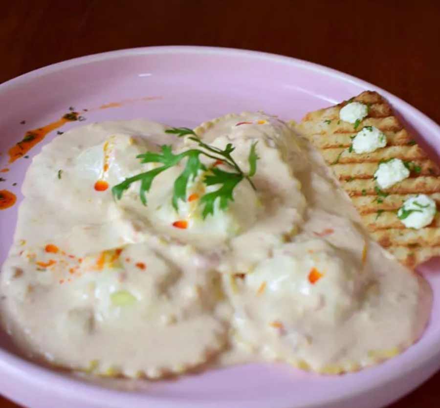 RAVIOLI WITH TOMATO, PESTO & CHEESE FROM LA MACARIO CAFE: The claim to fame at this all-day dining cafe on Wood Street is the variety of dips and festive hampers but they also make a mean ravioli. Think hand-rolled pasta dough, filled with flavours of tomatoes and pesto, stirred in a creamy cheese sauce