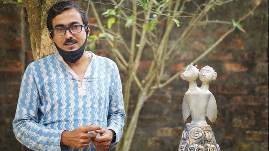 Tamal Bhattacharya with one of his works that depicts Vishnu’s avatars 