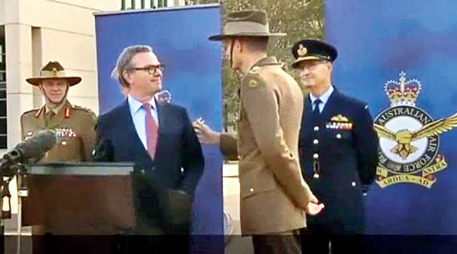 Footage shows Australian defence chief Gen. Angus Campbell telling  defence minister Christopher Pyne in 2019 that military officers should move away when the minister answers political questions.