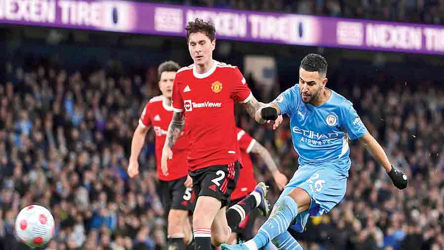 Riyad Mahrez (right) scores his second and Manchester City’s fourth goal against Manchester United on Sunday.