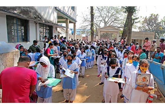 Students of Class X wait in queue to enter an examination centre in Bolpur, Birbhum on the first day of he Madhyamik 2022 examinations being conducted by the West Bengal Board of Secondary Education (WBBSE).