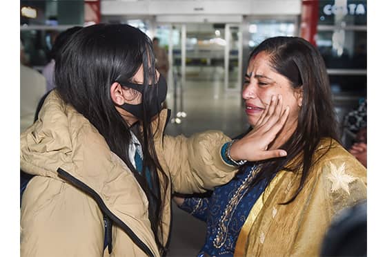 An Indian student evacuated from war-torn Ukraine reunites with family upon her arrival at the IGI Airport in New Delhi on March 7.
