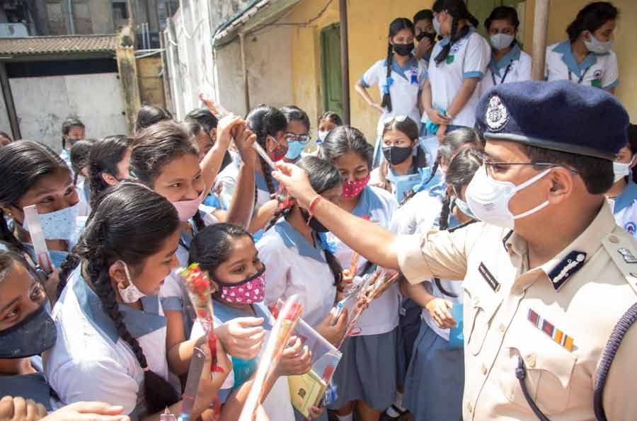 Kolkata police commissioner Vineet Kumar Goyal greets Madhyamik examinees before the exam at a school in north Kolkata on Monday 
