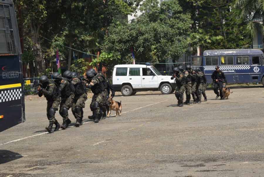 Members of Kolkata police’s combat battalion, commando unit, special forces and disaster management group stage an anti-terror drill at the training institute on Monday