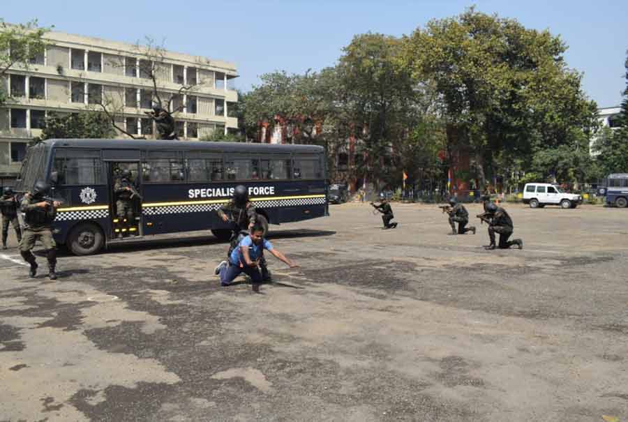 Kolkata police personnel conduct a drill to rescue passengers of a hijacked bus on Monday at the police training school in south Kolkata. Kolkata police commissioner Vineet Kumar Goyal attended the anti-terror drill on Monday