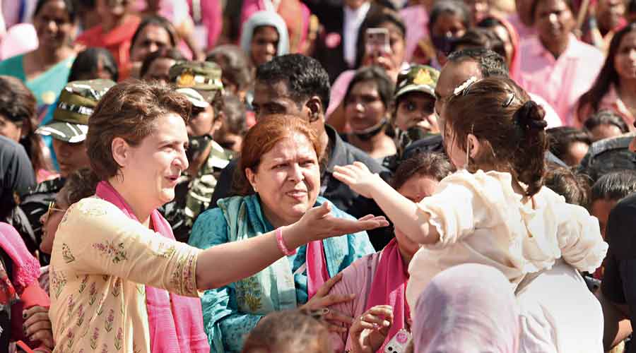 Priyanka interacts with a child during the women’s march  in Lucknow on Tuesday.